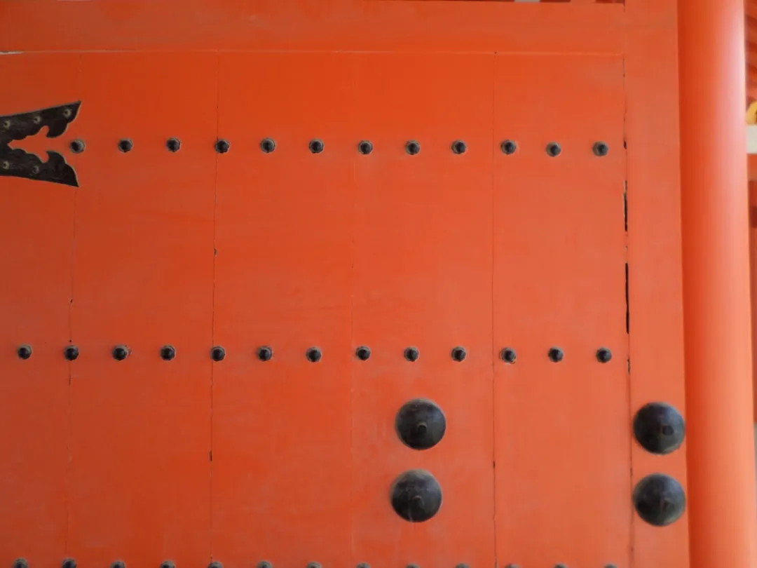 a close up of a wall with holes in it