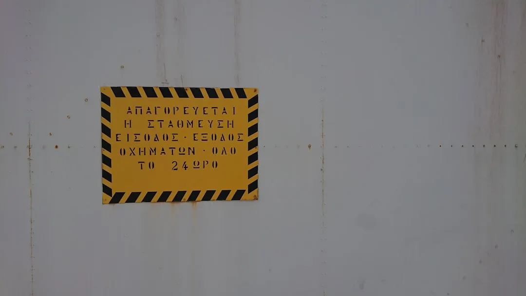 yellow and black signboard on wall