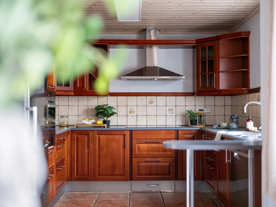 A kitchen with a table a sink and cabinets