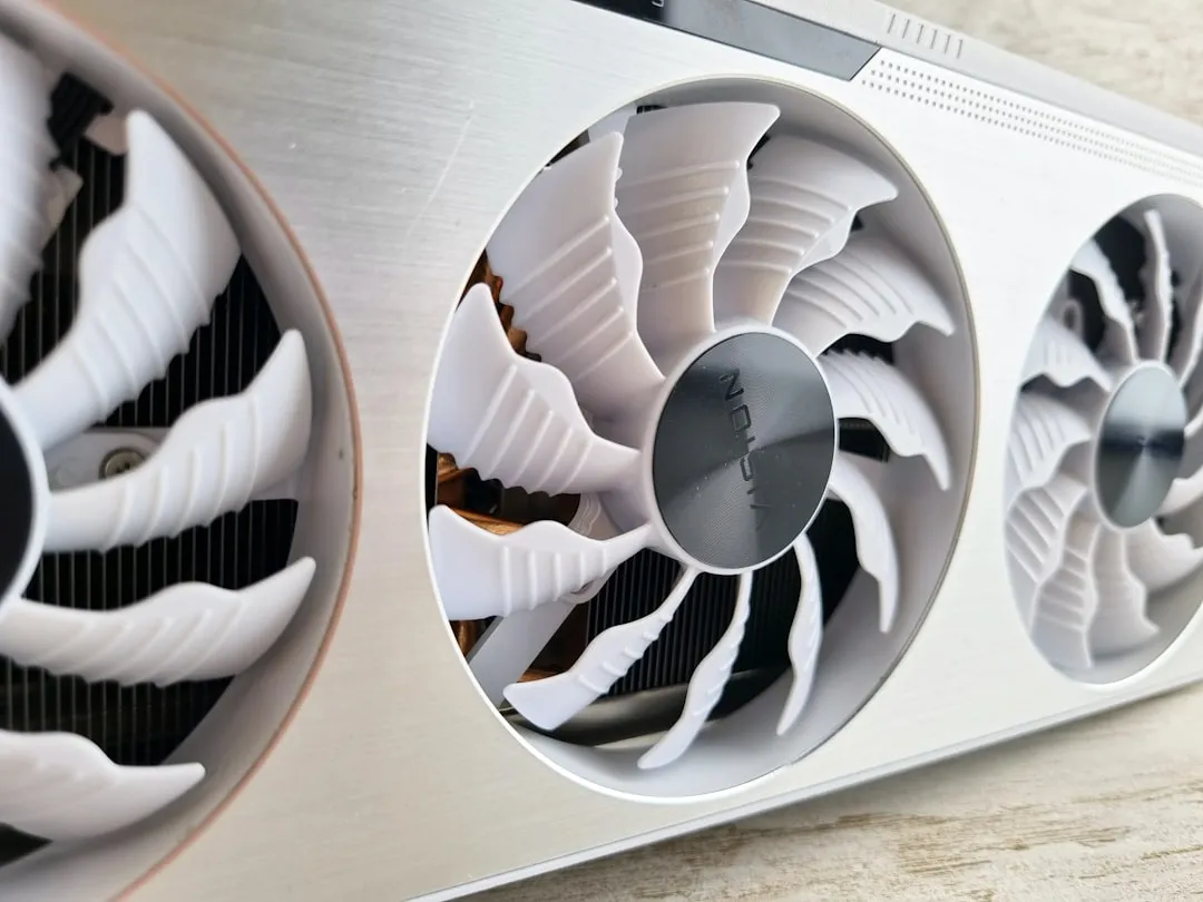 a close up of two fans on a metal surface
