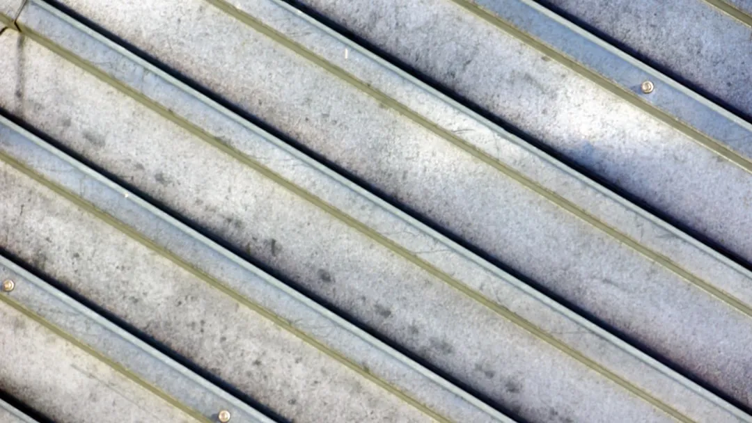 Close-up of corrugated metal surface with diagonal lines